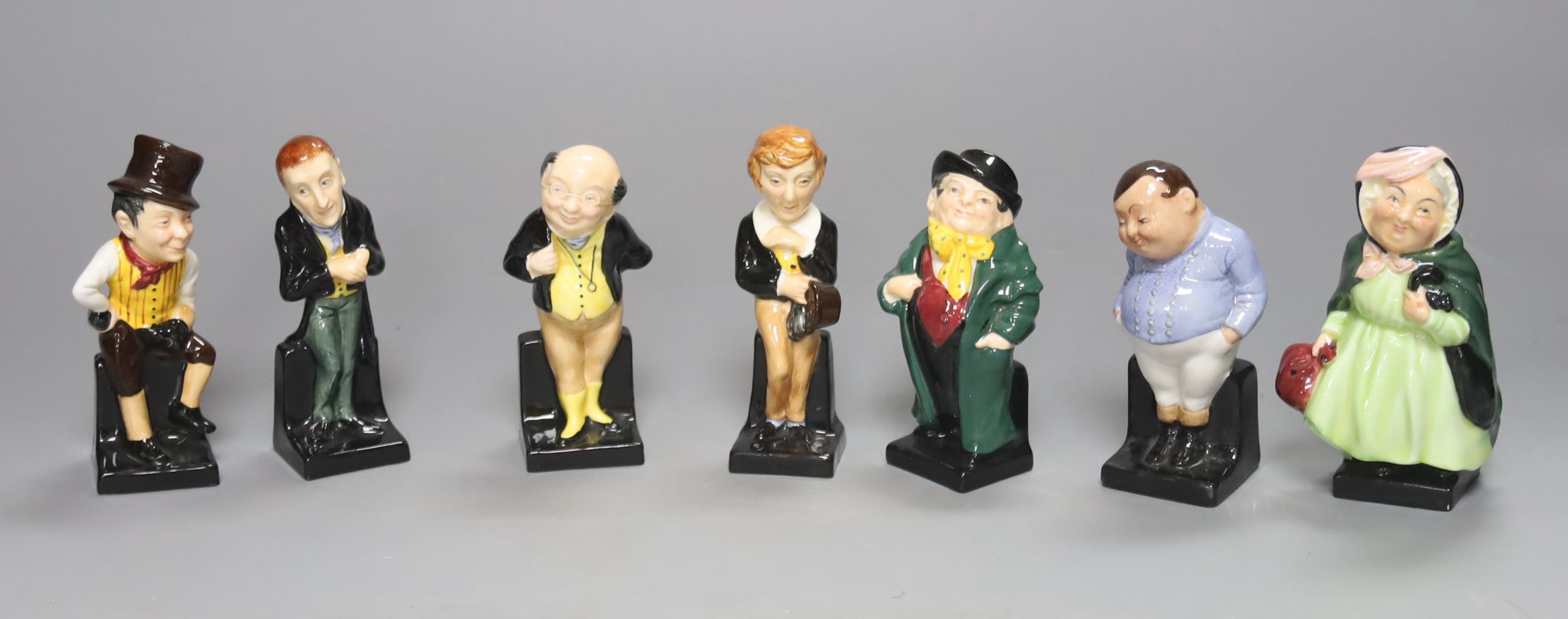 Seven Royal Doulton figures: Sam Weller, Sairey Gamp, David Copperfield, Pickwick, Fat Boy, Tony Weller and Uria Heep